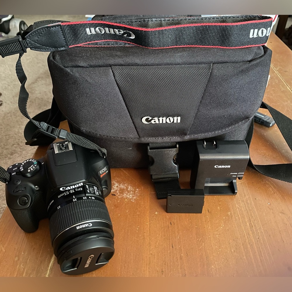 Canon EOS Rebel T6 with lens, battery, battery charger, and canon camera bag